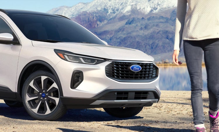 Ford Sedan driving on desert road